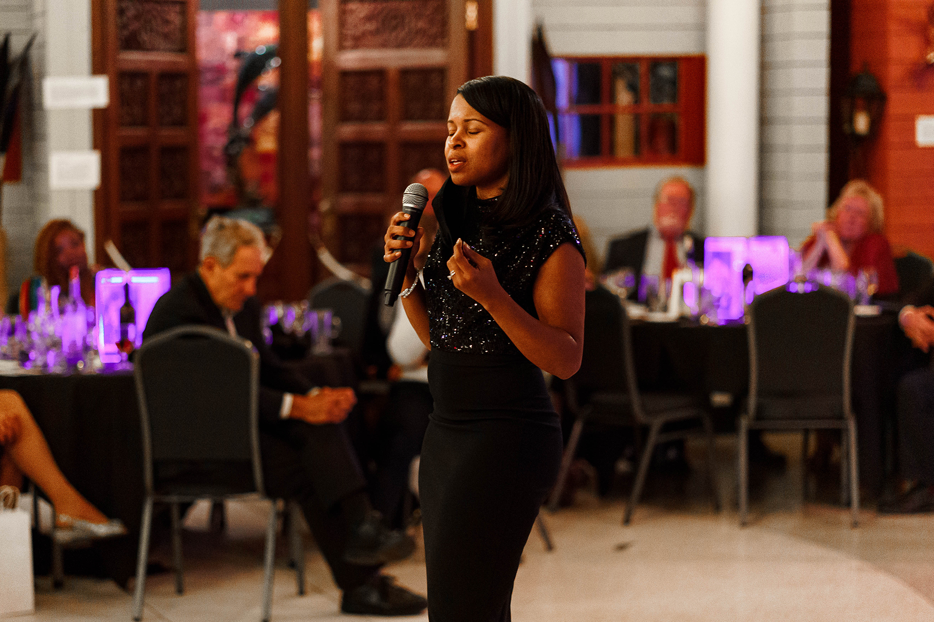 Woman talking into a microphone
